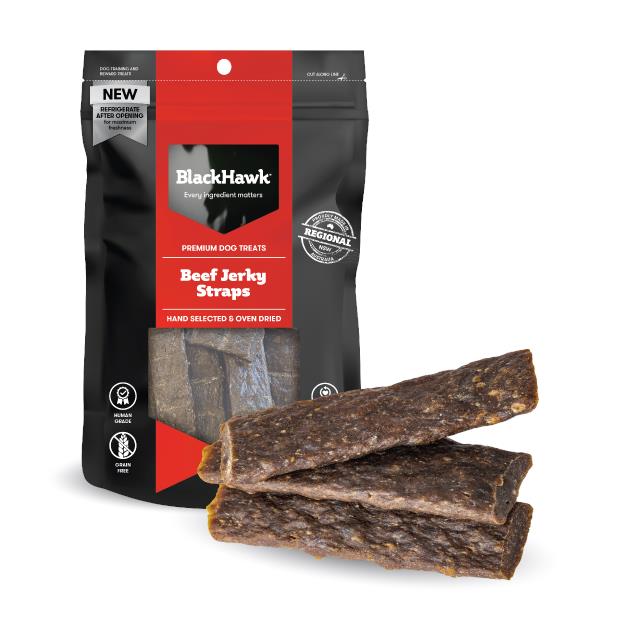 Brown strips of dog treat viewed through clear window in black and red bag and labelled as made in australia (regional nsw). 